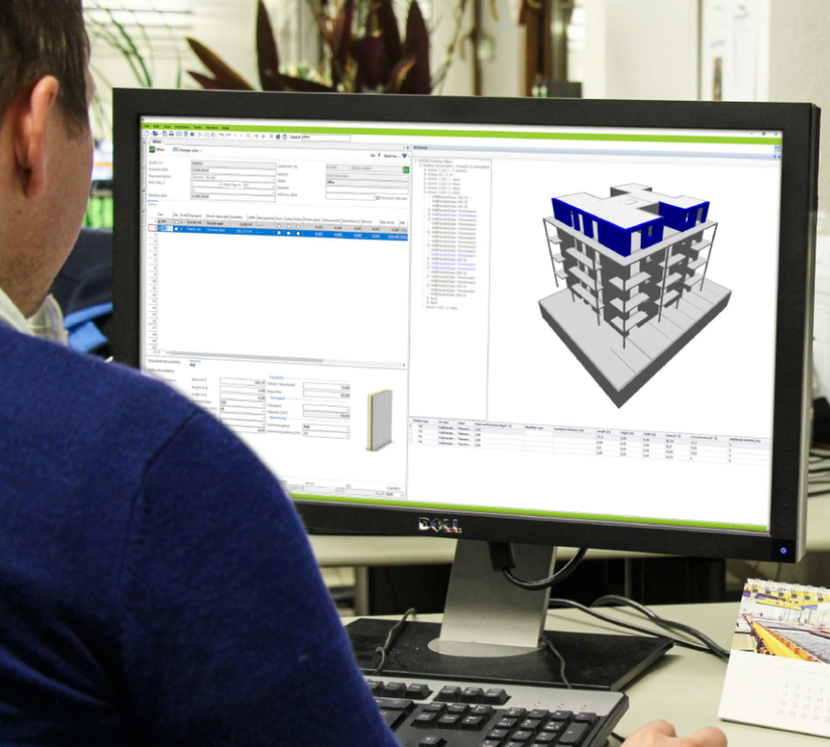Engineer at BIM workstation with building model